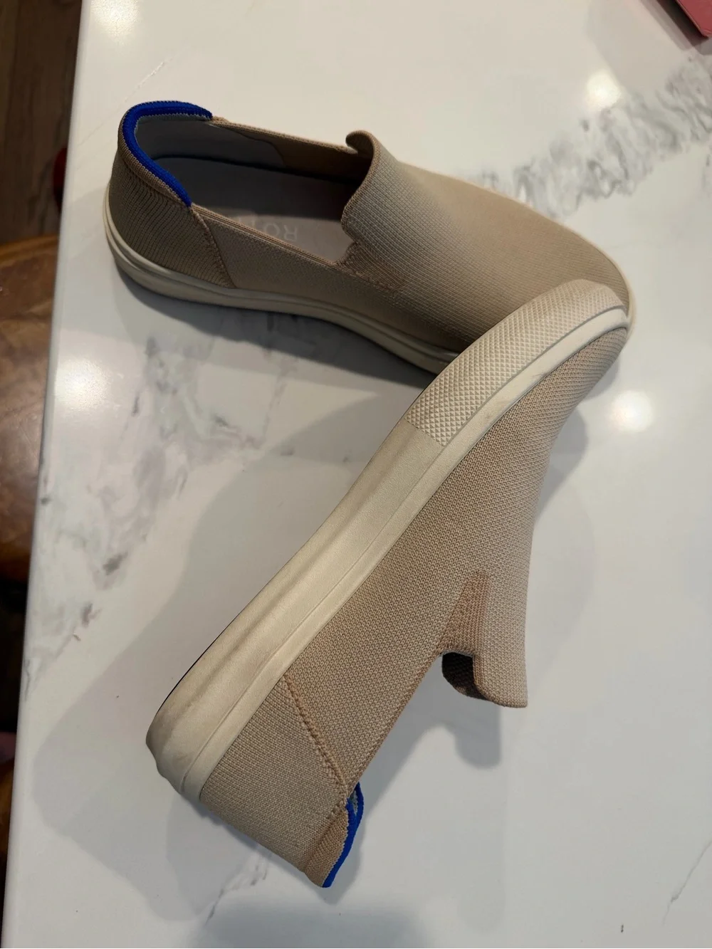 Rothy's Slip-On Flats in Tan with Blue Heel Accent